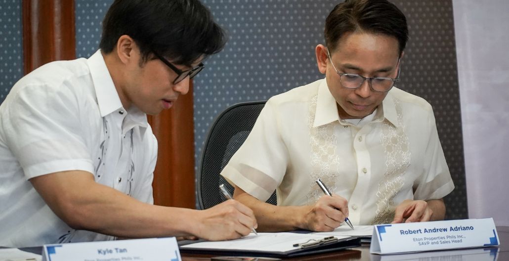 Kyle Ellis C. Tan with Robert Andew Adriano at the Eton Properties and PNB partnership signing